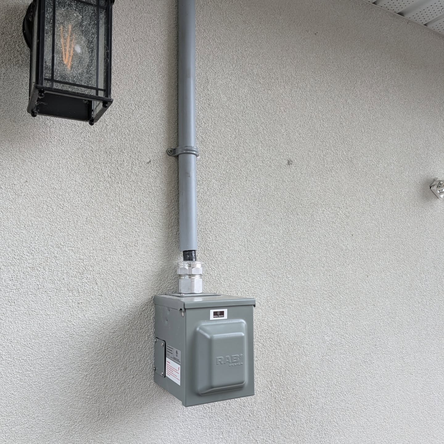 Weatherproof charging outlet and exterior conduit